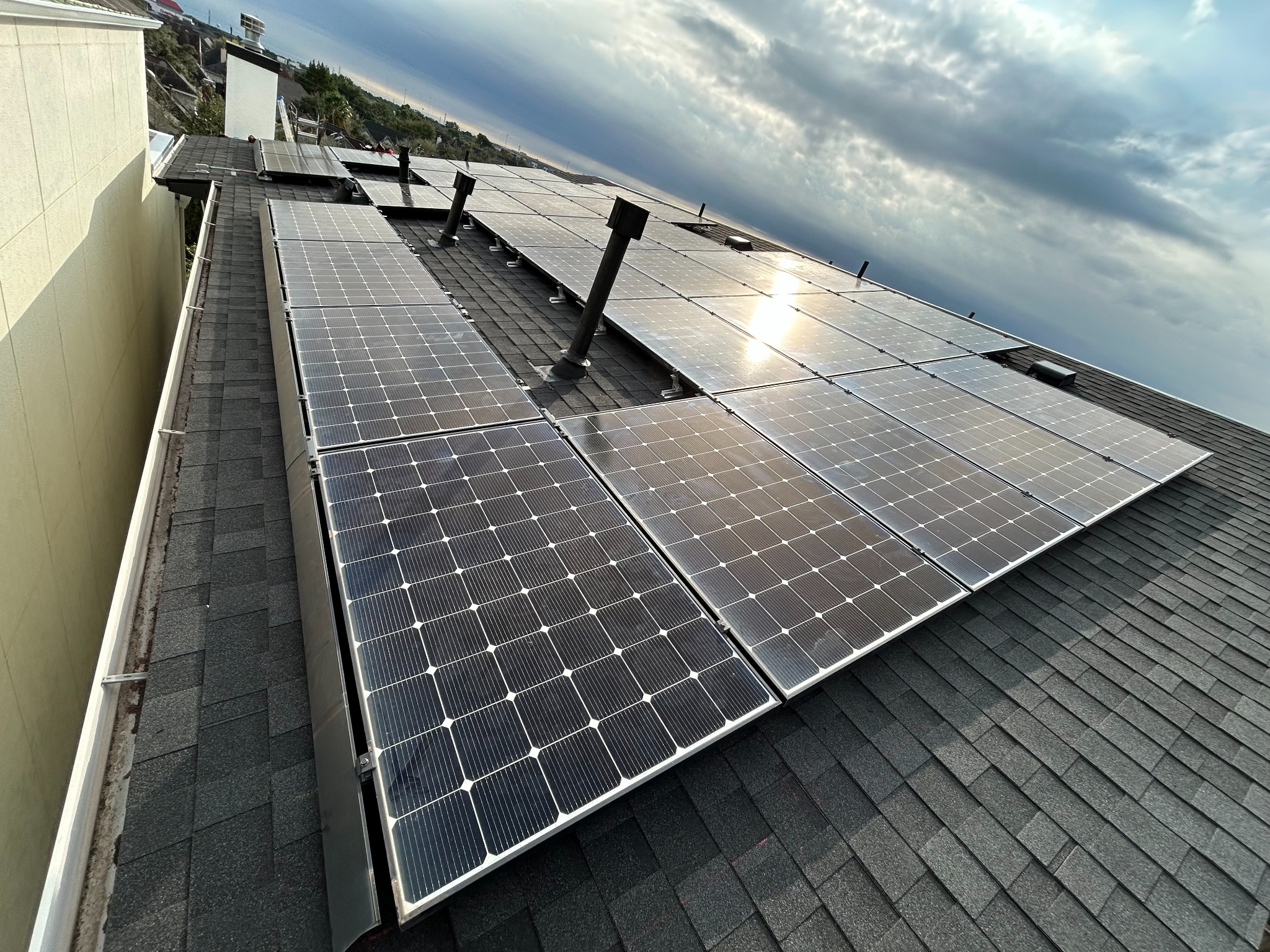 Rail-less solar array after completed Green Gold Electric detach-and-reset work on a three-story home in Houston, Texas